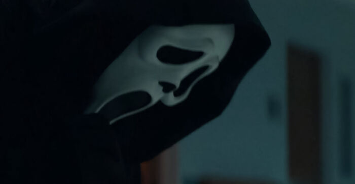Ghostface looking down at someone 