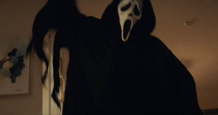 Ghostface shouting at someone in the room 