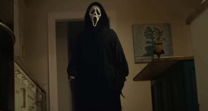 Ghostface looking at someone in the room 