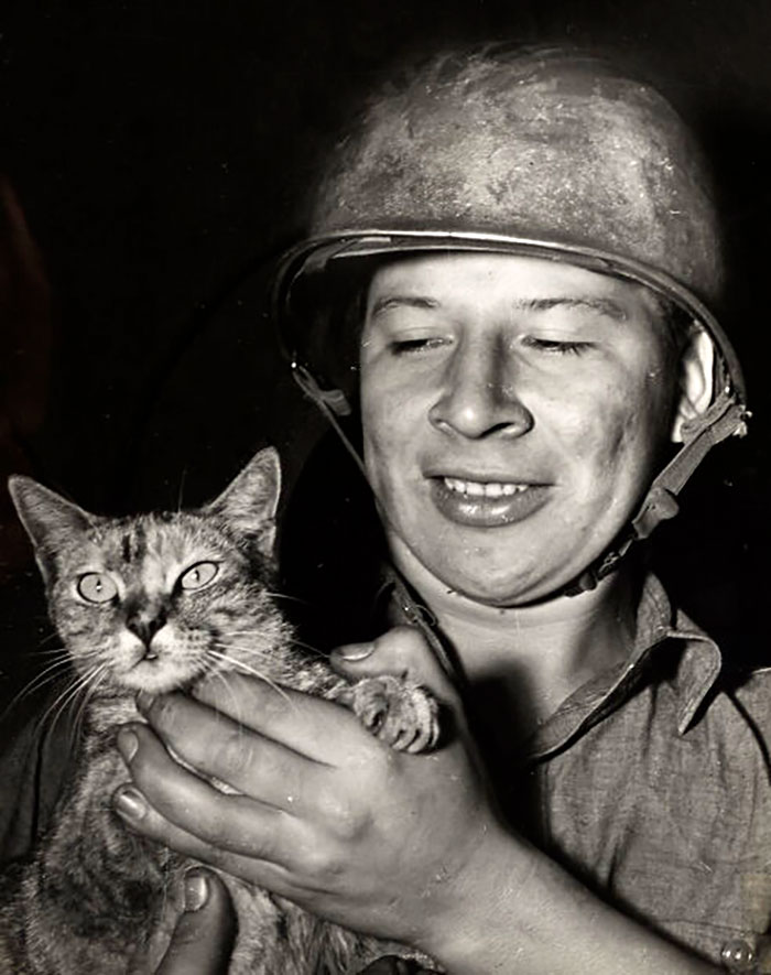 Coast Guardsman Henry Richmond Jr. Holding "Camouflage" The Cat Mascot Of His Coast Guard-Manned Landing Ship