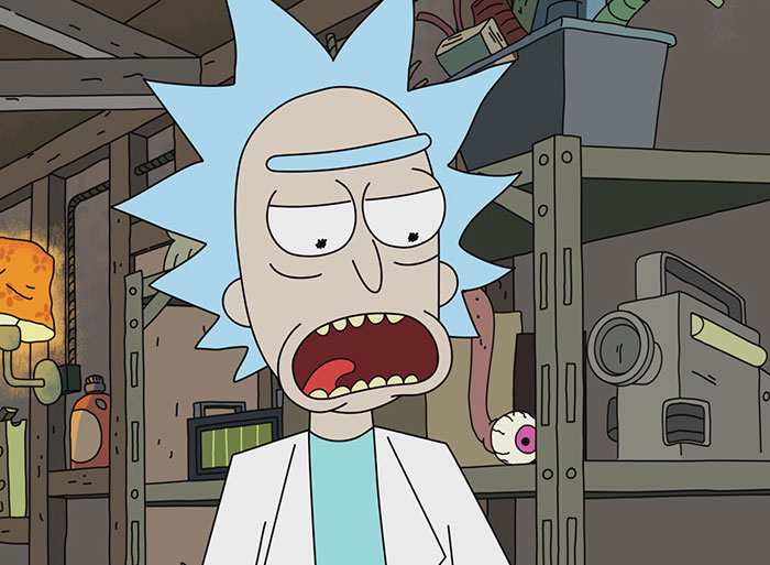 Rick talking and wearing lab coat