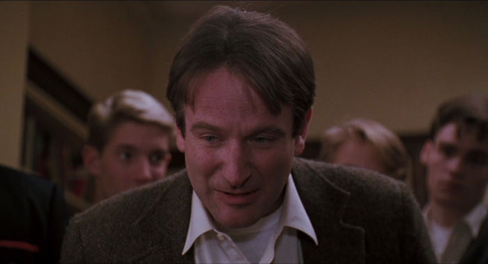 robin williams talking surrounded by people in dead poets society