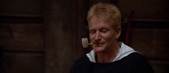 robin williams with a smoking pipe in popeye