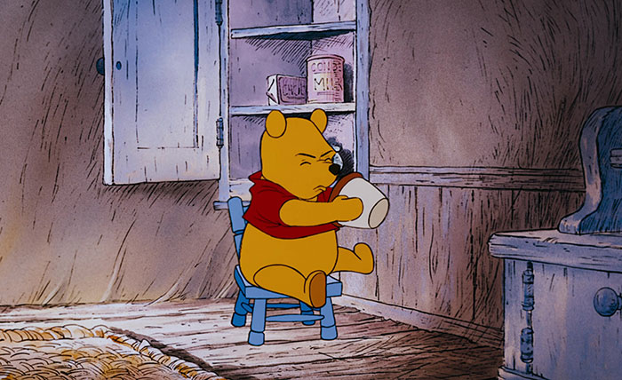 Winnie the Pooh holding a pot
