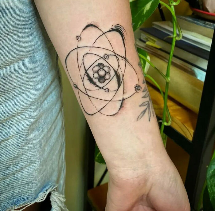 Rutherford’s atomic model tattoo on arm