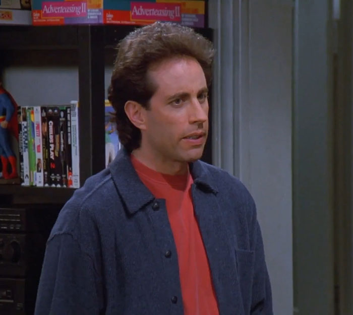 Jerry from Seinfeld wearing a blue jacket and red shirt, representing funniest Seinfeld quotes about everyday life humor.