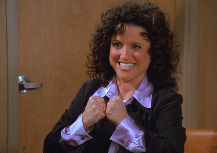 Elaine wearing black jacket and purple shirt