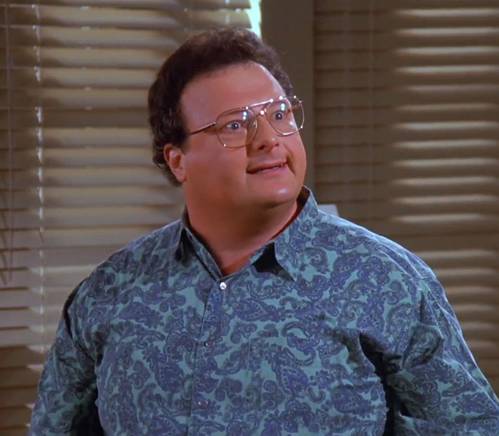 Newman wearing blue shirt