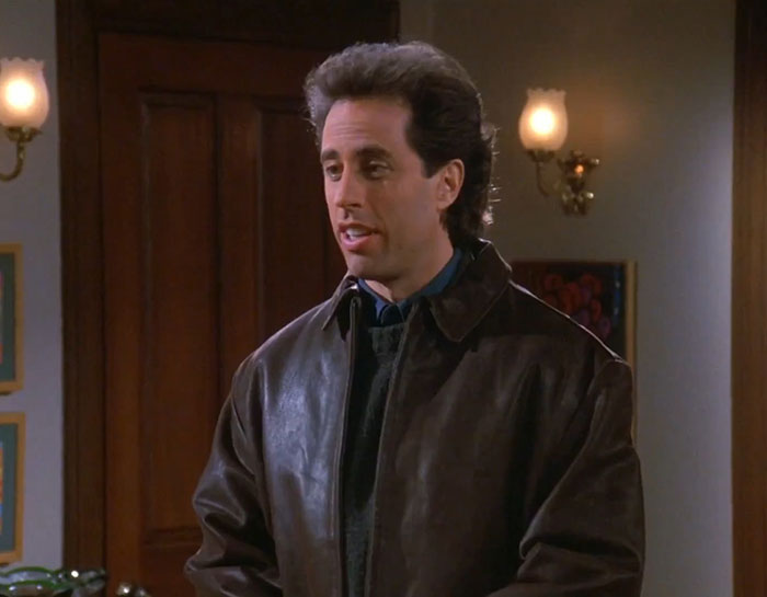 Jerry wearing brown jacket