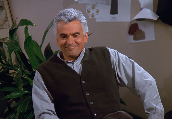  J. Peterman wearing brown and blue clothes