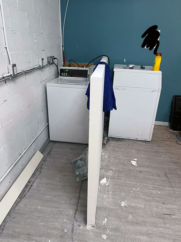 Landlords Installed A Wall Between Laundry Machines So You Can’t Easily Transfer Your Clothes From One To The Other