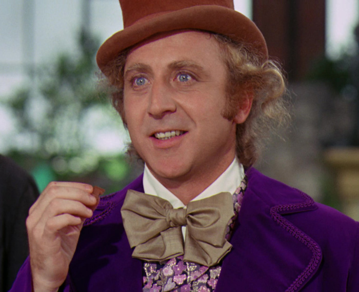 Willy Wonka holding chocolate 