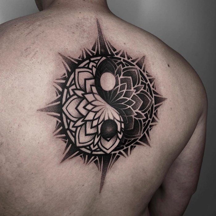 Yin yang symbol back tattoo