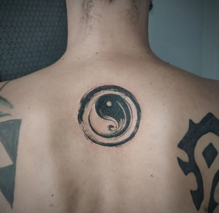 Yin yang symbol tattoo