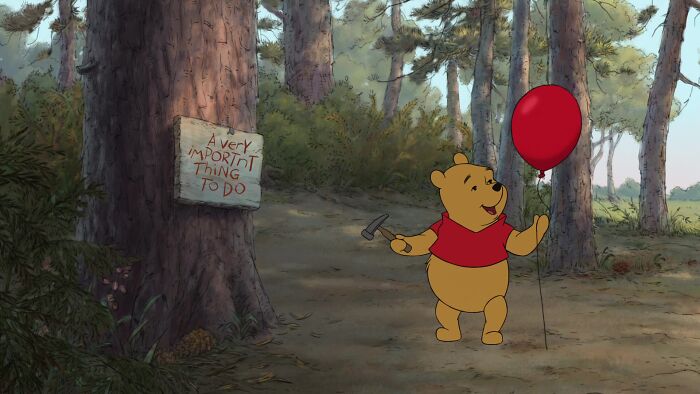 Winnie The Pooh Holding A Red Balloon And Hammer In A Forest 