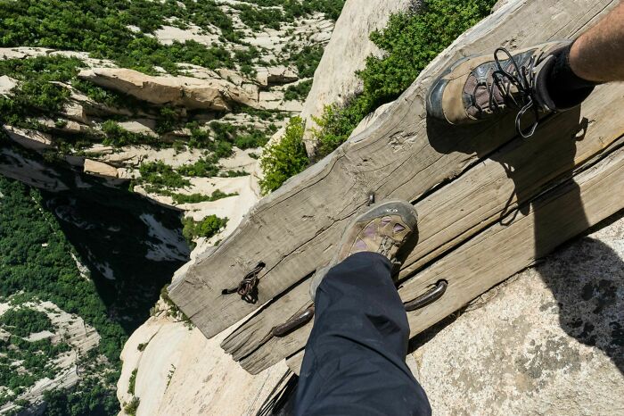 Hanging Out On A Plank, 2000-Feet-High On The Edge Of A Cliff In China