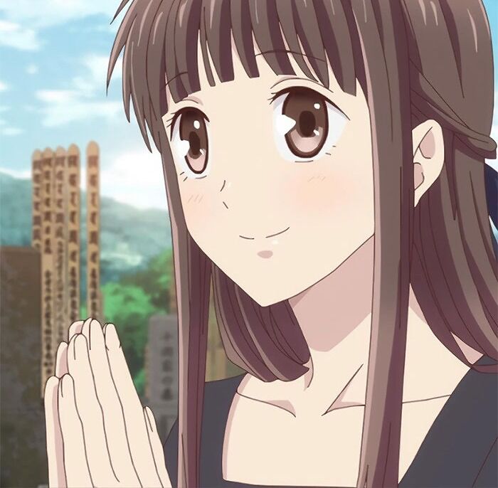 Female anime character with long brown hair, smiling softly, standing outdoors with hands clasped together.