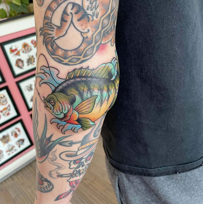 Watercolor fish elbow tattoo