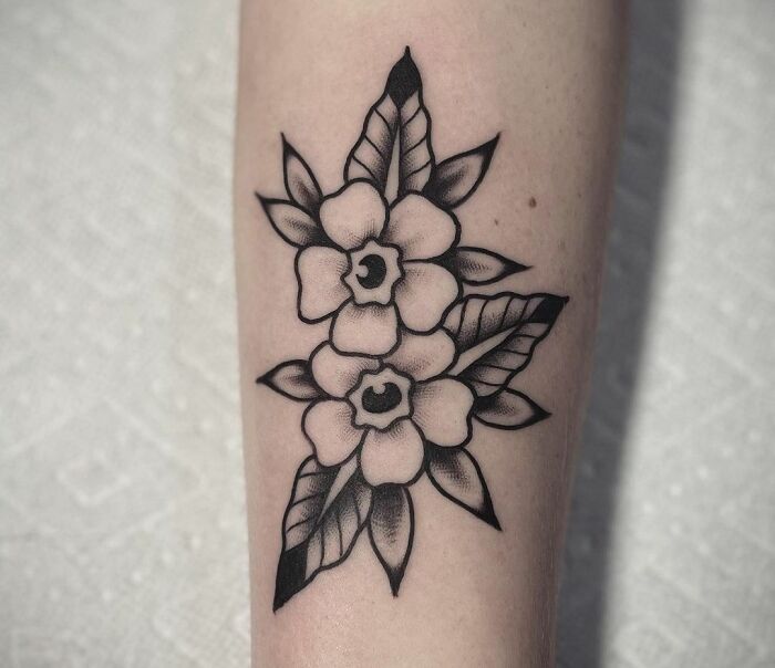American traditional flower arm tattoo