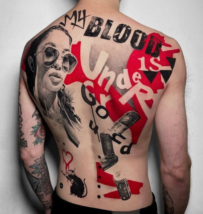 Large black and red ink back tattoo with woman face, cans and typography