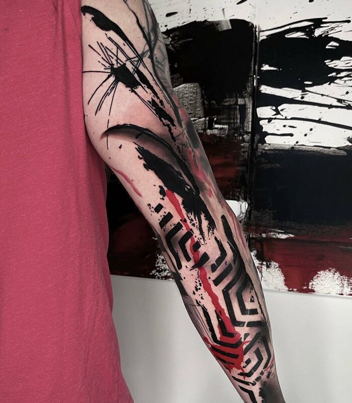 Abstract Trash Polka arm sleeve tattoo