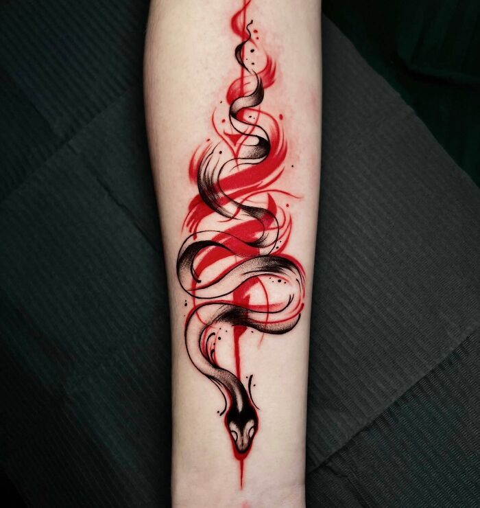 Abstract red and black curves snake tattoo