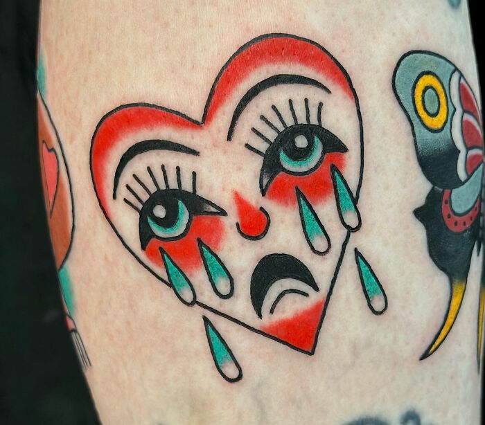 Crying heart American traditional tattoo design with bold colors and classic motifs.