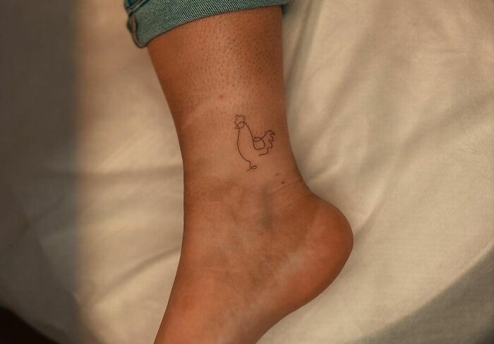 Minimalistic rooster ankle tattoo