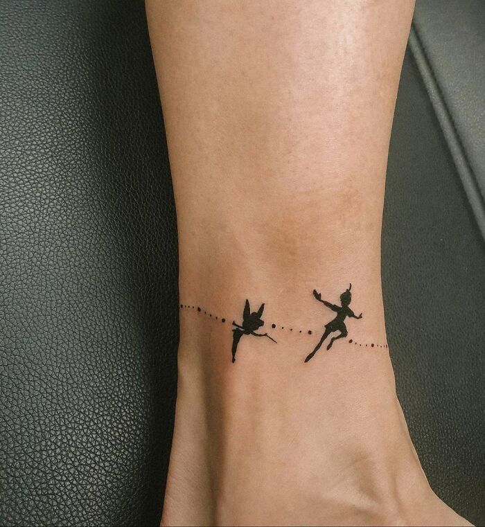 Dancing silhouettes ankle tattoo
