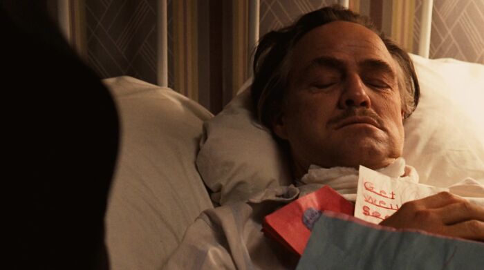 Don Vito Corleone sleeping in bed 