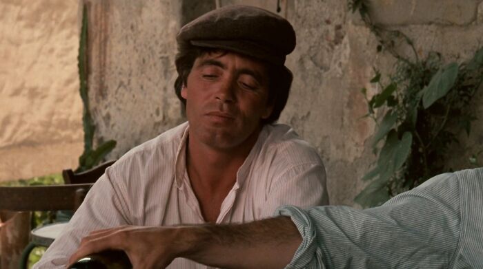 Calo looking down to the bottle