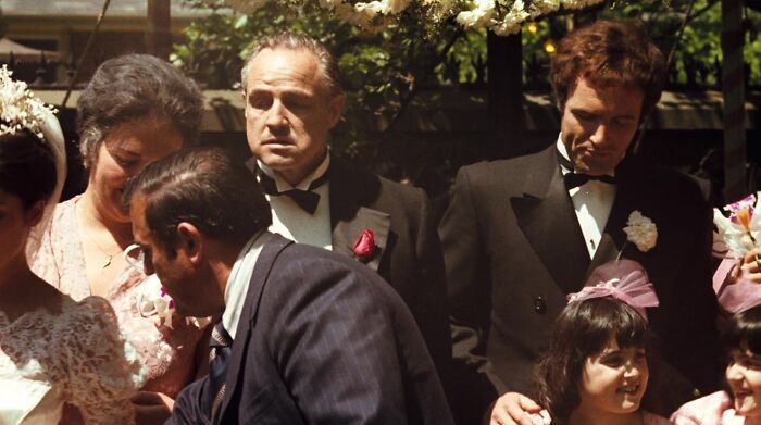 Don Vito Corleone standing at wedding 