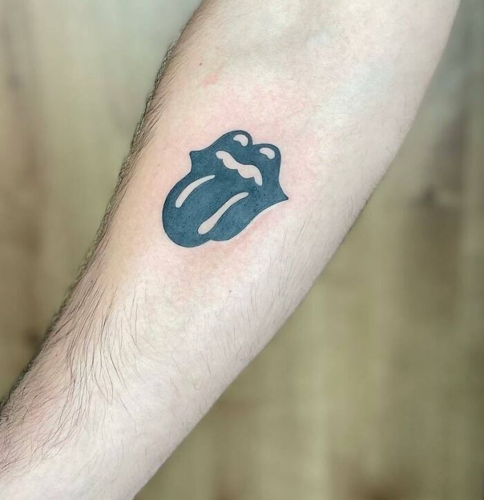 Black rolling stones logo tattoo