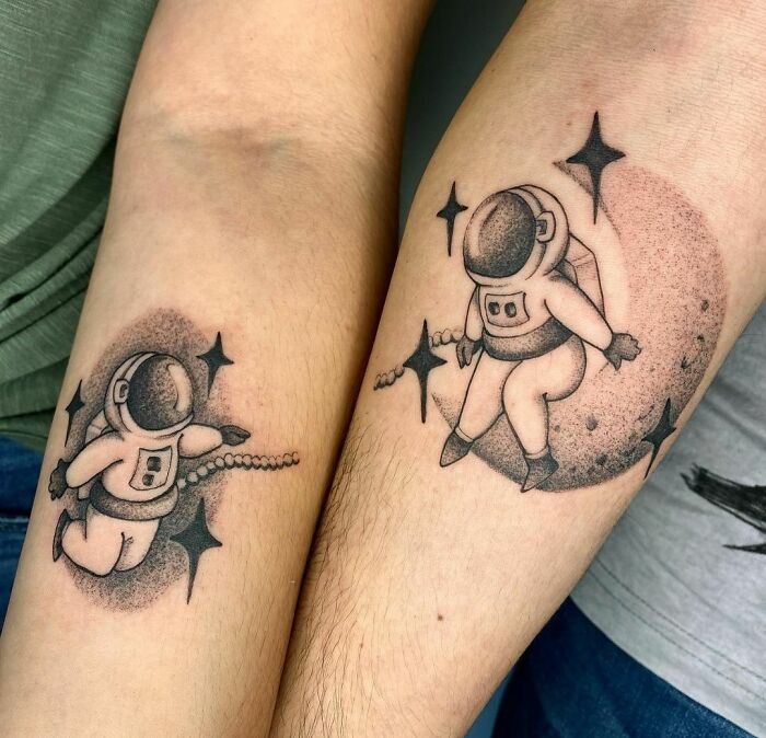 Couple space astronaut tattoos