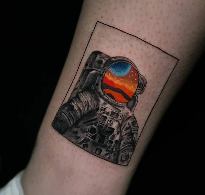Astronaut leg tattoo