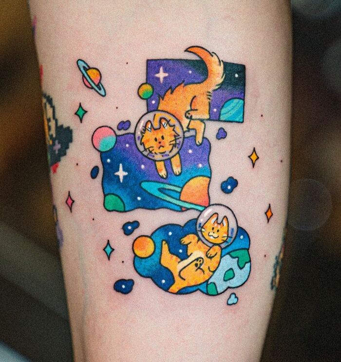 Space cats arm tattoo