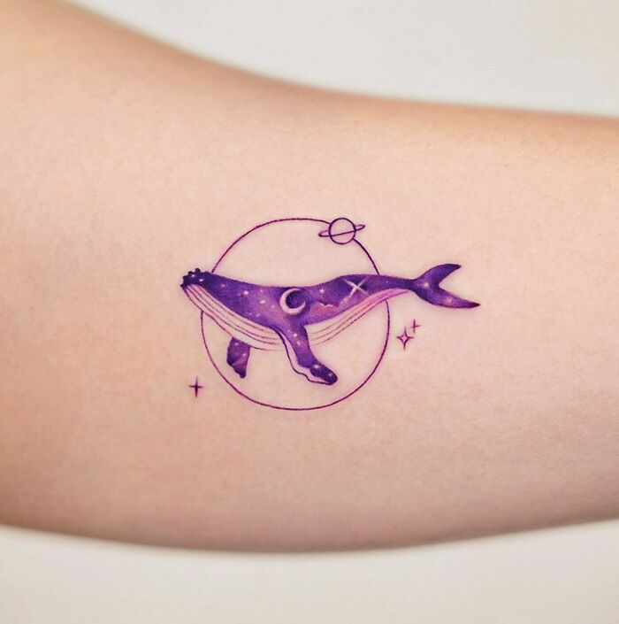 Space whale arm tattoo