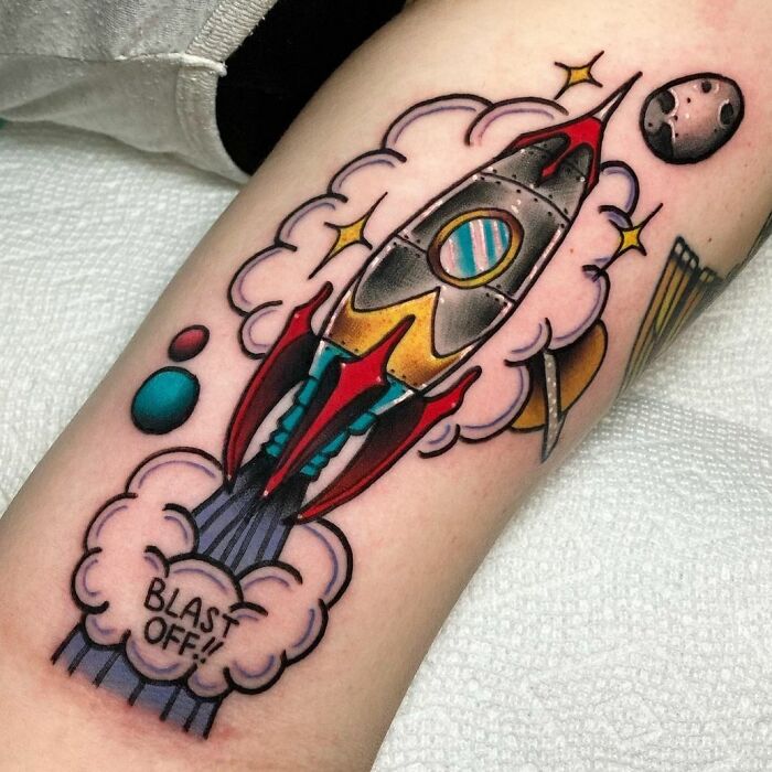Spaceship arm tattoo