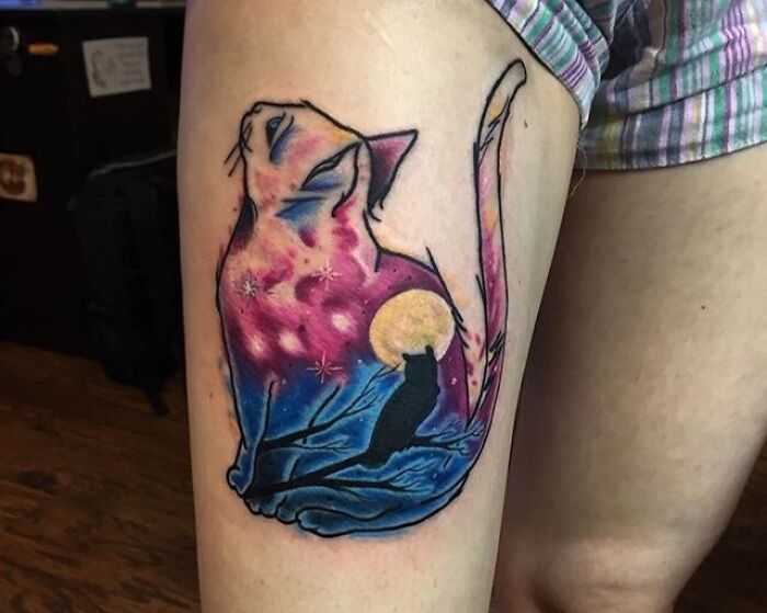 Watercolor space cat leg tattoo