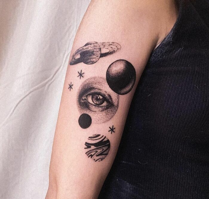 Planets and eye arm tattoo