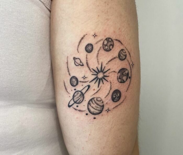 Milky Way and planets arm tattoo