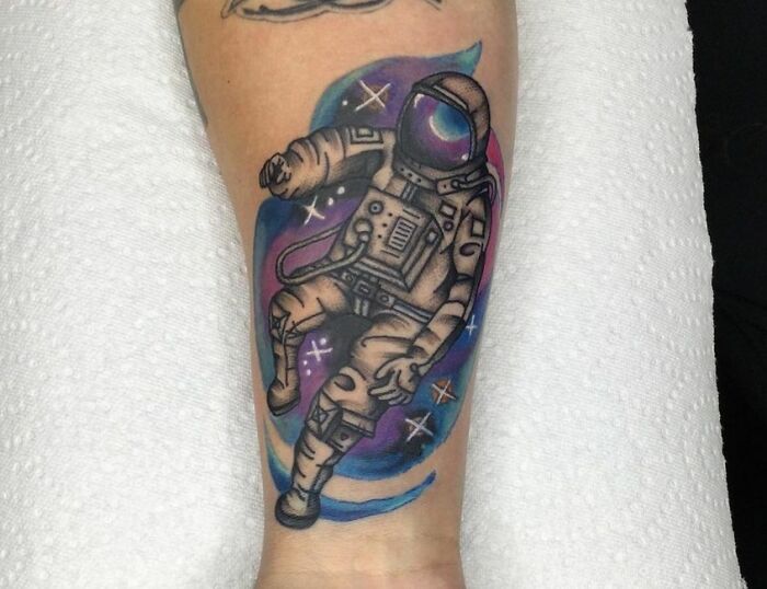 Watercolor astronaut tattoo
