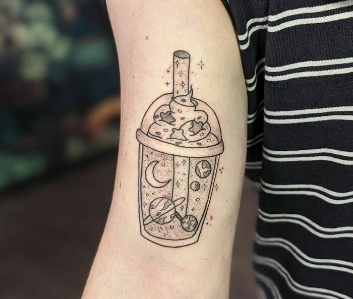 Spacey boba tea arm tattoo