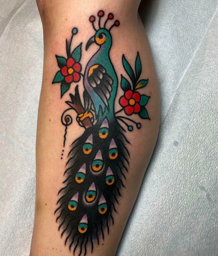 American traditional peacock leg tattoo