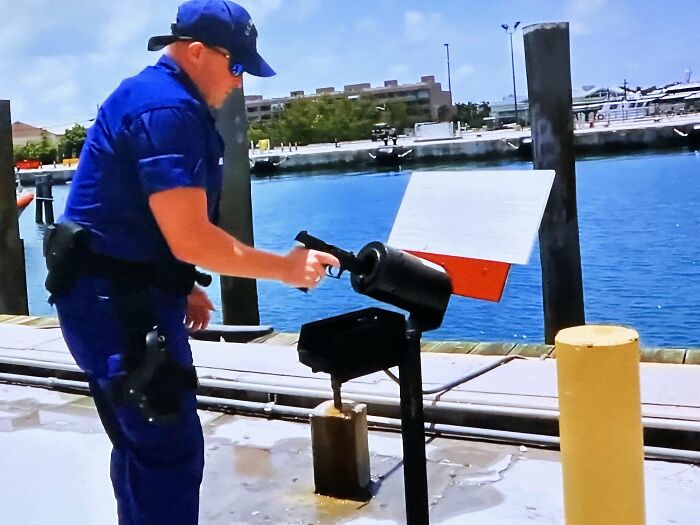 What Is This Tube That This Coast Guard Guy Sticks His Gun Into While Loading It?