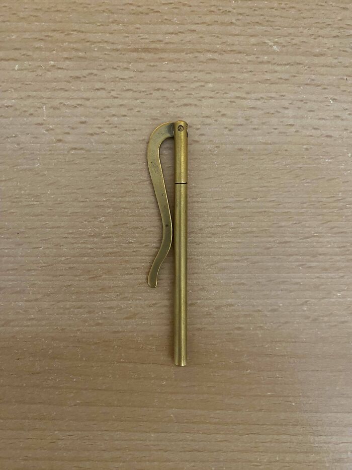 What Is This Small Metal(Seemingly Brass) Rod With A Wavy Arm That Opens?