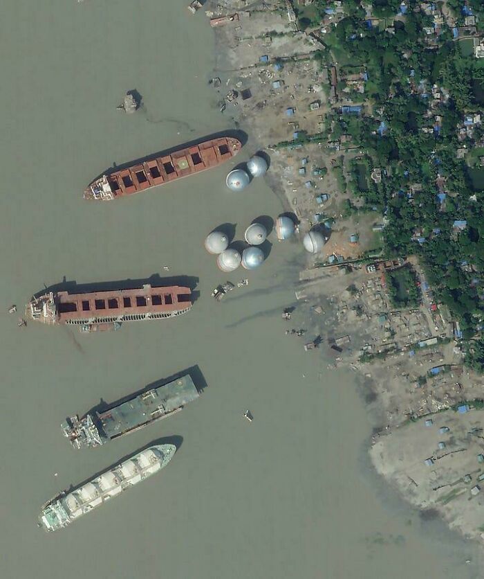 What Are These Eight Massive Silver-Ish Metal Spheres Or Containers Floating Near The Shore At A Ship Breaking Yard In Bangladesh?