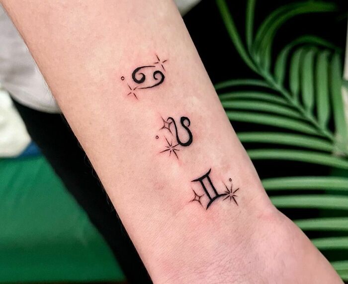 Cancer, Leo and Gemini signs arm tattoo