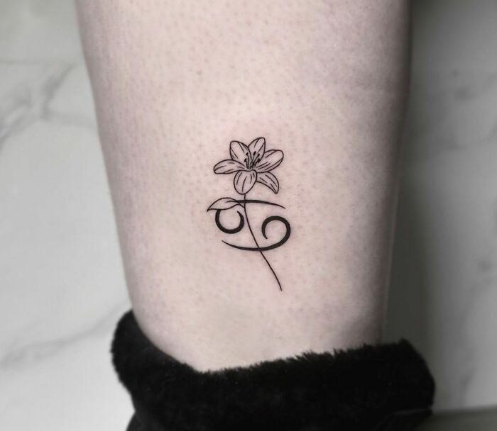 Small cancer leg tattoo