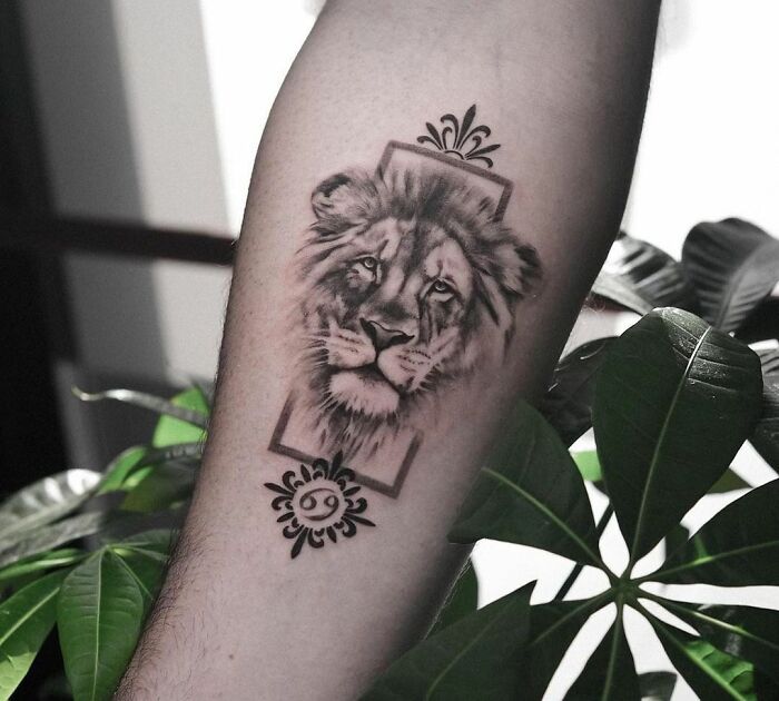 Leo and Cancer symbol arm tattoo